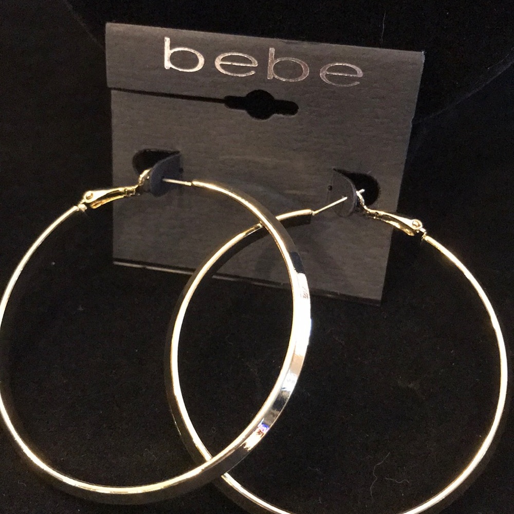 Bebe, gold 2” hoop earrings.